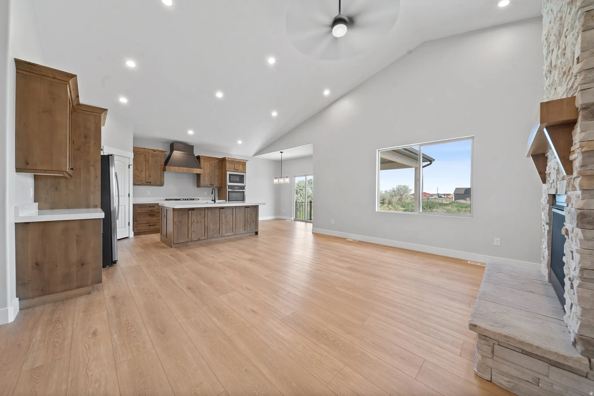 An Eagle Point Homes open floor plan connecting the kitchen with the main living space
